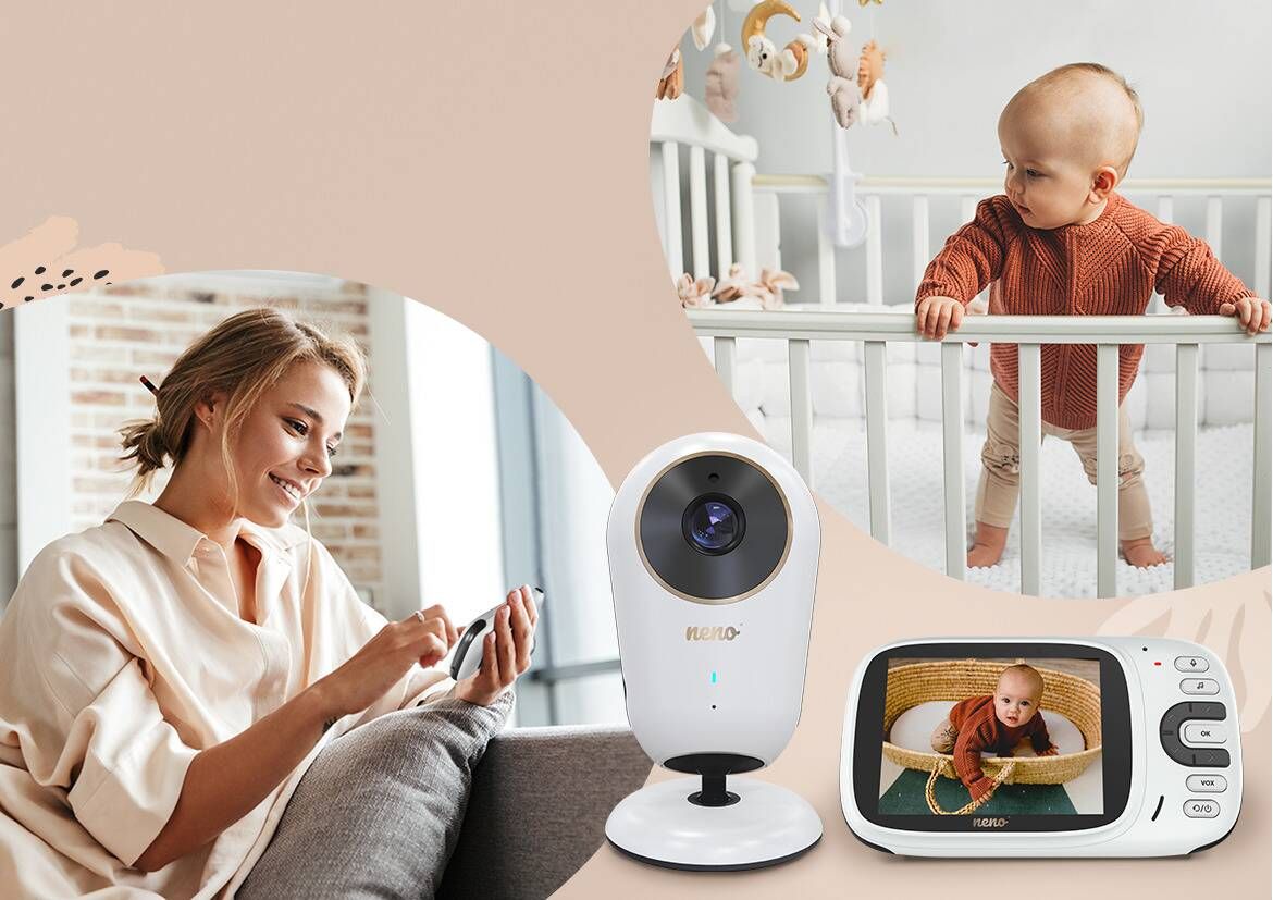 a baby in a bed and a mother looking at the baby using a camera