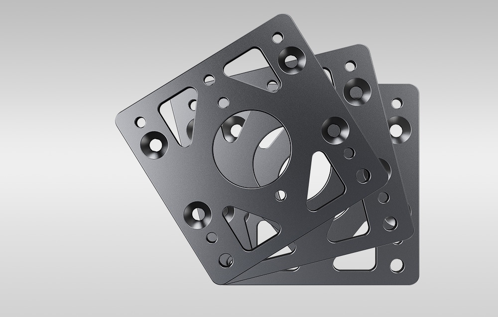 Szare tło, na którym widać 3 nachodzące na siebie bazy mocujące Moza.