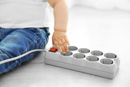Little baby playing with electric power bar