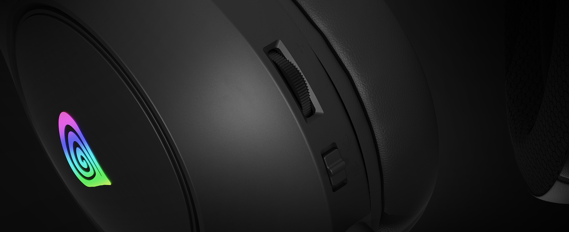 Zbliżenie na słuchawki Genesis Neon 213 RGB z czarną konstrukcją, kolorowym logo i pokrętłem regulacji głośności