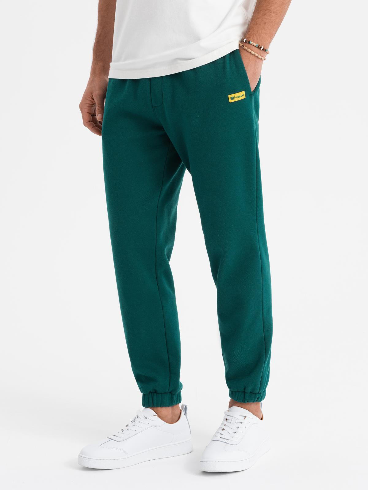 Klasyczne dresowe spodnie unisex ciemnozielone V17 OU-PSBC-0100 XL/XXL – Komfort i styl w jednym