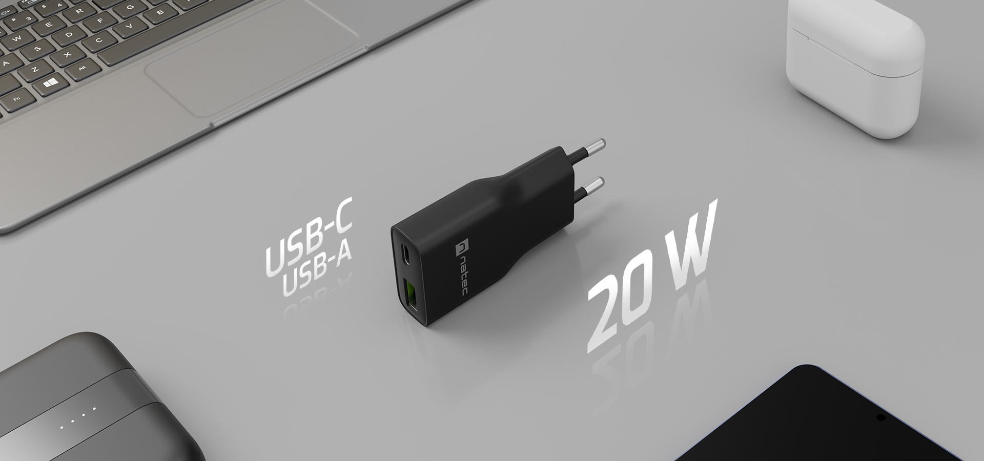 Ładowarka z dwoma rodzajami portów oraz mocą wskazaną na boku.