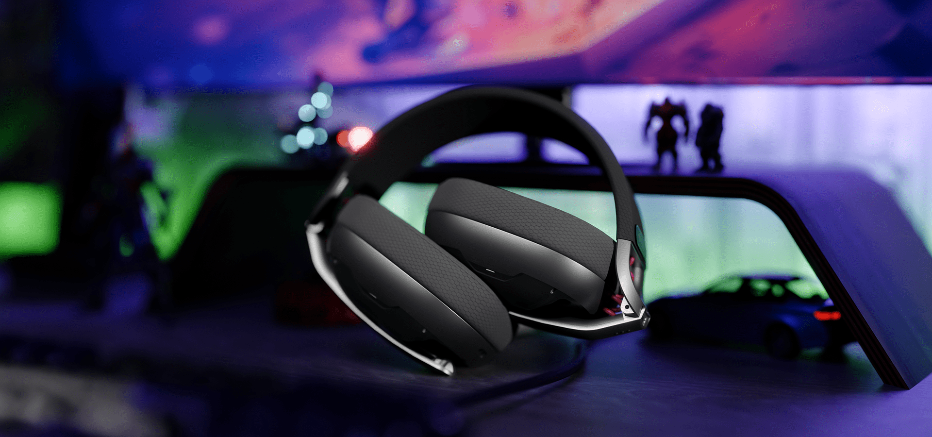 Słuchawki z wyściełanymi nausznikami umieszczone na półce w kolorowym zestawie gamingowym.