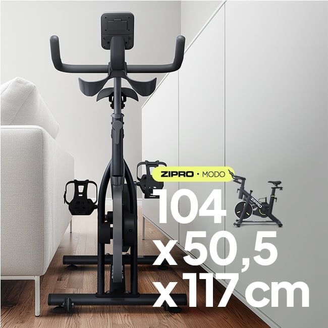 Rower spinningowy ZIPRO Modo -wizualizacja pokazująca jak rowerek mieści się w ciasnych przestrzeniach mieszkania. Wymiary rowerka 104x50,5x117cm.