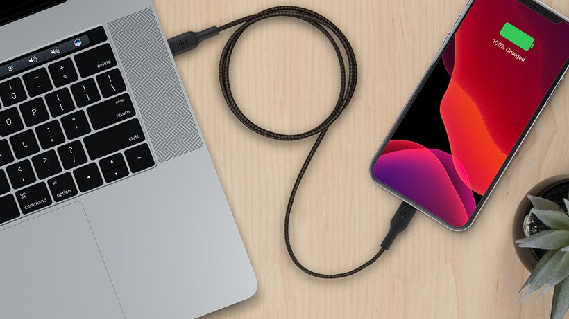 Guaranteed to work with your iPhone and iPad Belkin Boost↑Charge Braided Cable charging an iPhone with a Mac laptop