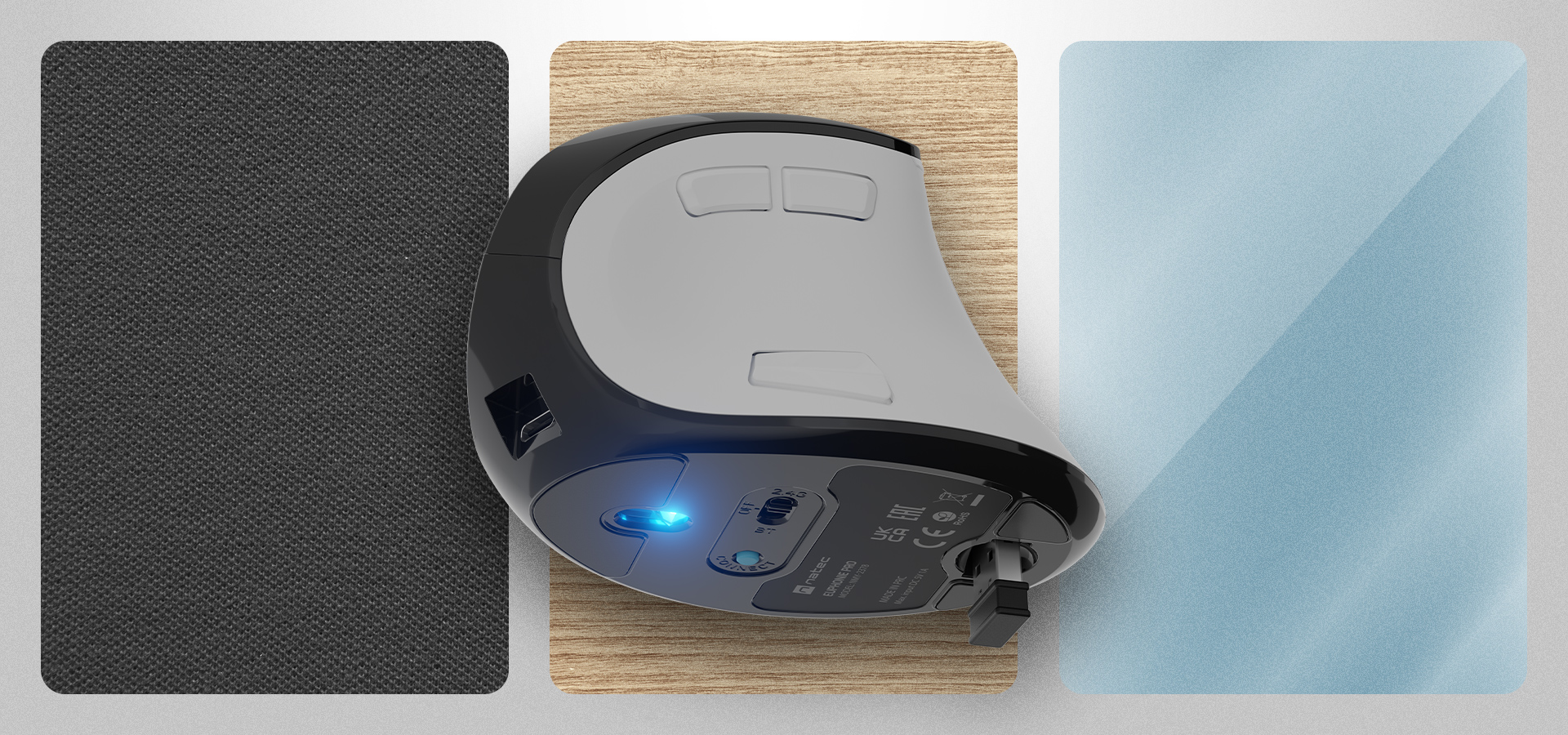 Mysz z przewodem i świecącym światłem na tle teksturowanej powierzchni.