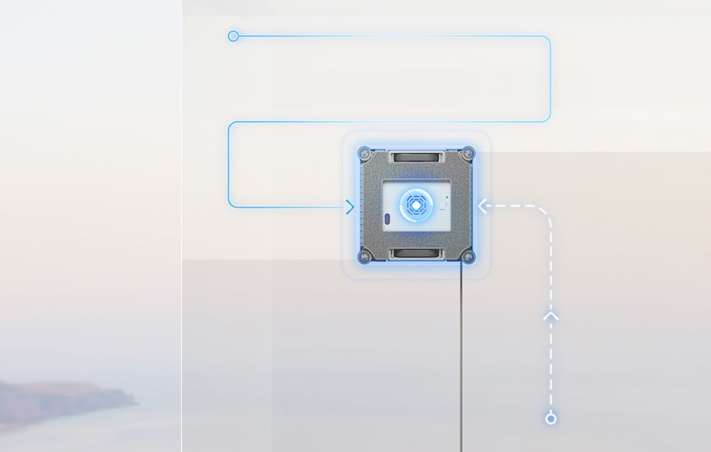 Widok od spodu na robota Dreame C1 Station podczas pracy na szybie, z niebieskimi liniami ilustrującymi jego tor ruchu