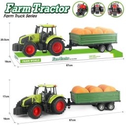 Traktor z belami słomy