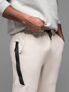 Męskie spodnie dresowe ze ściągaczami i ozdobnym zamkiem  piaskowe V6 OM-PASK-0226 XL 5