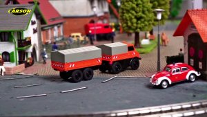 Himoto Carson 1:87 M-B Unimog U406 z przyczepą 2,4G 100% RTR pomarańczowy (500504177) 3
