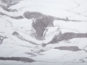 Beliani Stół do jadalni 110 cm efekt marmuru z czarnym MOSBY 3