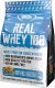 Real Pharm REAL PHARM REAL WHEY 100 KONCENTRAT BIAŁKA PROSZEK 700G - Masło orzechowe 1