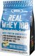 Real Pharm REAL PHARM REAL WHEY 100 KONCENTRAT BIAŁKA PROSZEK 700G - Wanilia-sernik 1