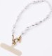 Uniq UNIQ Coehl Perla Handstrap uniwersalny    sznurek do telefonu na rękę biały/white pearl 1