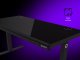 Dual-motor sit/stand adjustable-height gaming desk with wireless charger, RGB lighting, control panel, and USB ports, solid tempered glass tabletop, black. 3