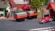 Himoto Carson 1:87 M-B Unimog U406 z przyczepą 2,4G 100% RTR pomarańczowy (500504177) 3
